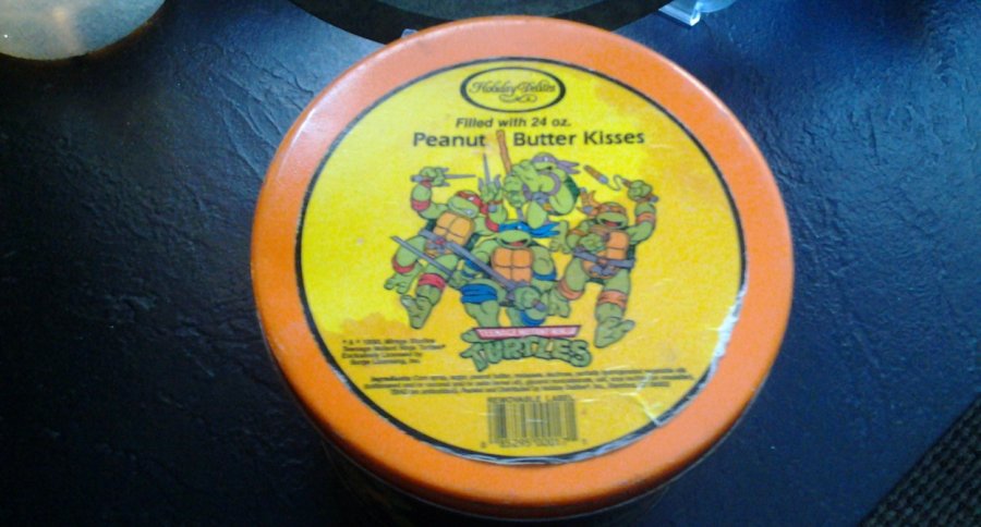 What's '1990 holiday delights peanut butter kisses teenage mutant ninja turtles tin' Worth? Picture