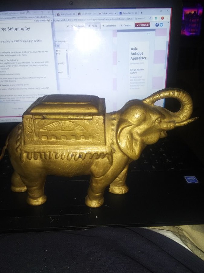 What's 'cast brass elephant cigarette roller from 20/s' Worth? Picture